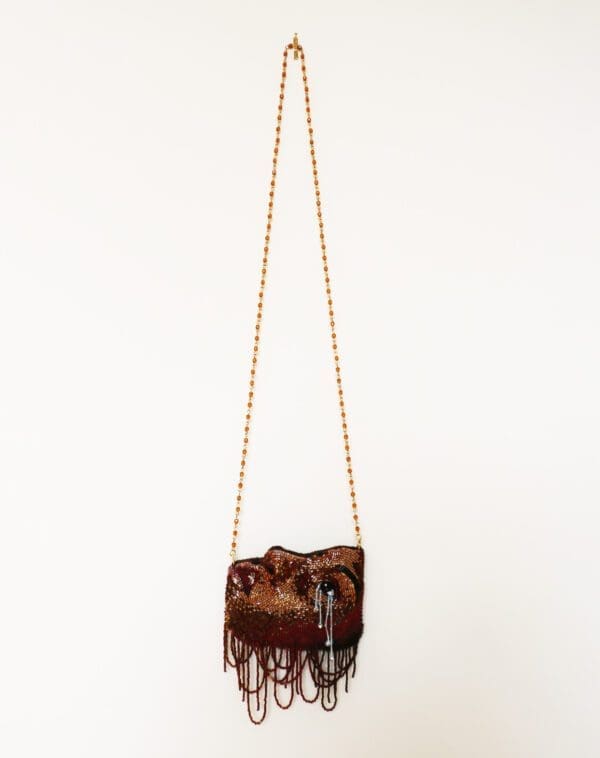 Brown face purse hanged to the hook
