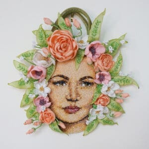 Floral beaded portrait with pink flowers.