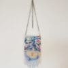 Beaded purse with a woman's portrait.